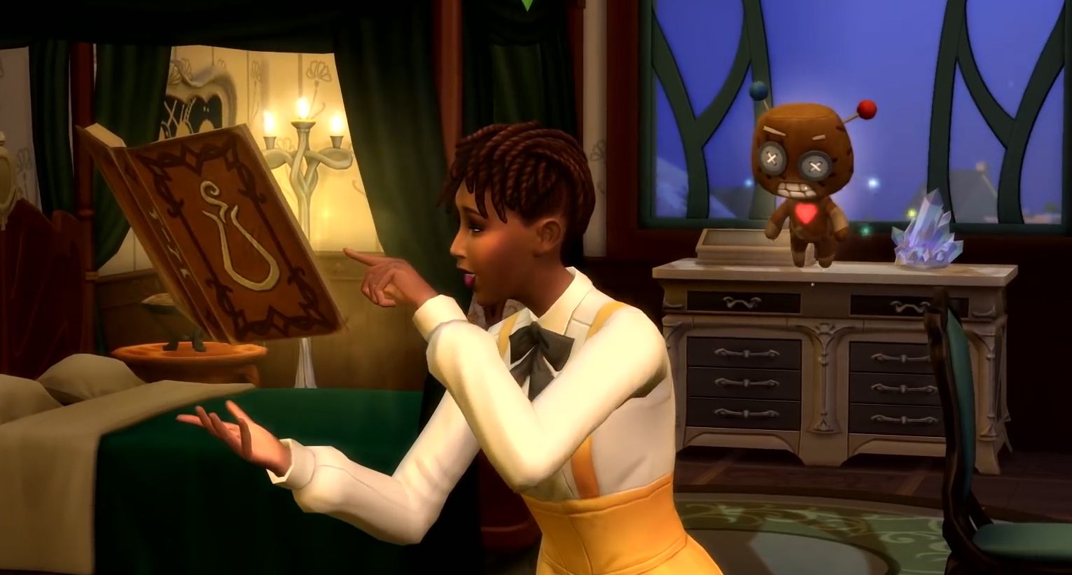 A sim learns a magic spell in The Sims 4 Realm of Magic