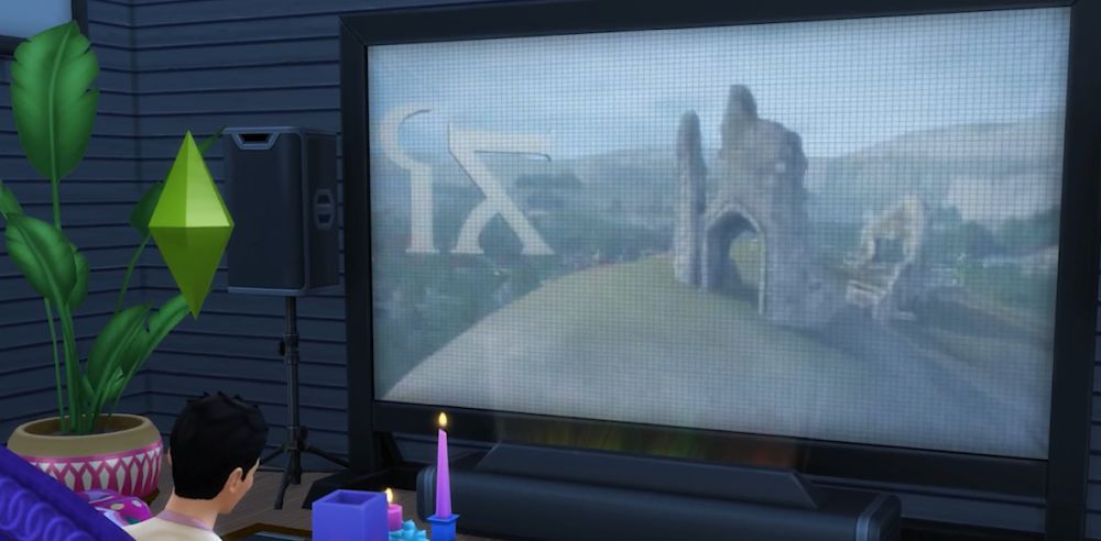A Sim watches a movie in The Sims 4 Movie Hangout